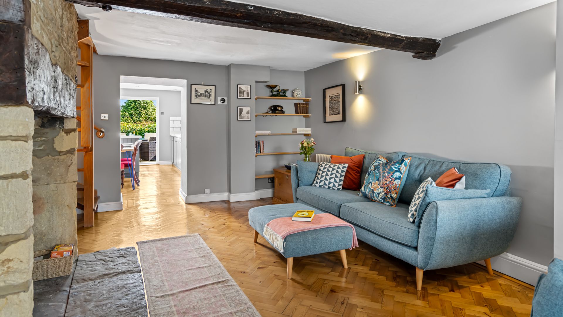 Soft blue sofas await as you relax in front of the fire