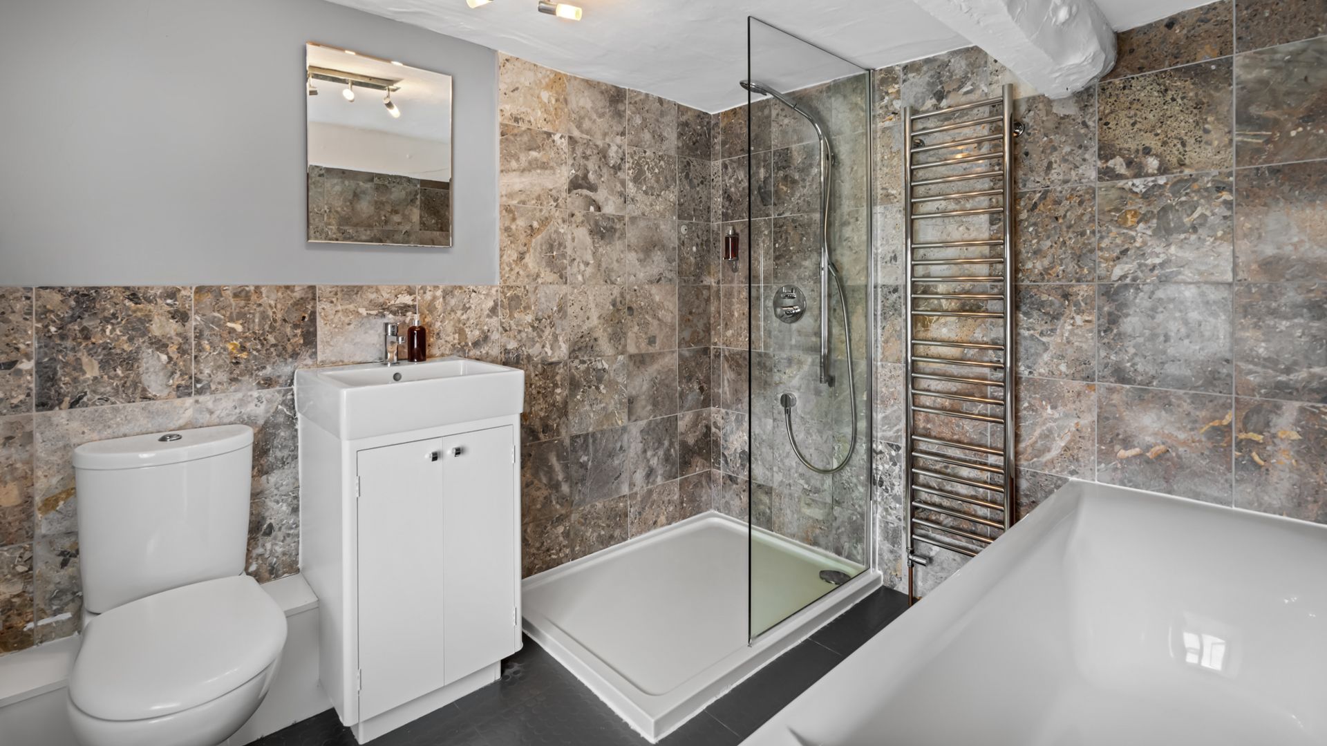 There is a spacious upstairs bathroom ready for long, relaxing soaks in the tub