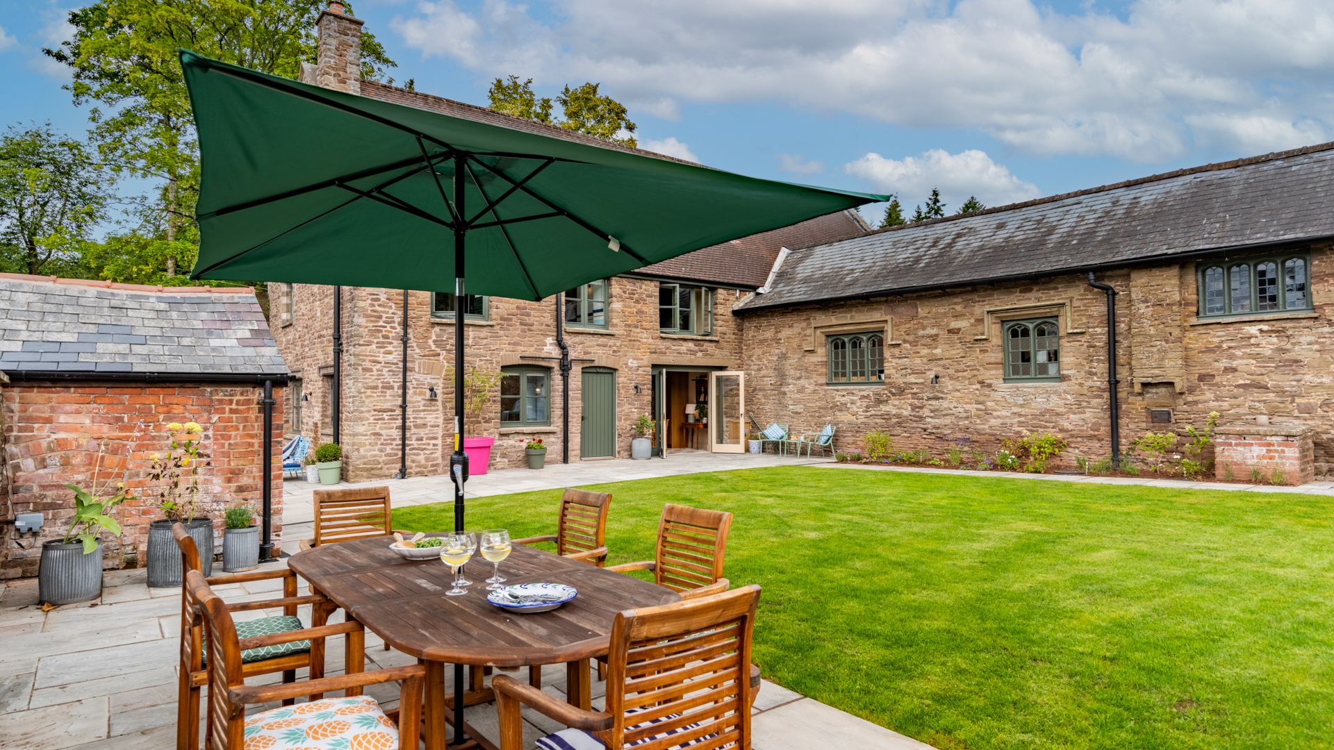 Upper Lodge's outside space is an immaculate walled garden with plenty of seating